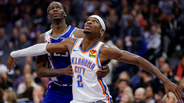 Nov 10, 2023; Sacramento, California, USA; Oklahoma City Thunder guard Shai Gilgeous-Alexander (2) is guarded by Sacramento Kings guard Keon Ellis (23) during the fourth quarter at Golden 1 Center.